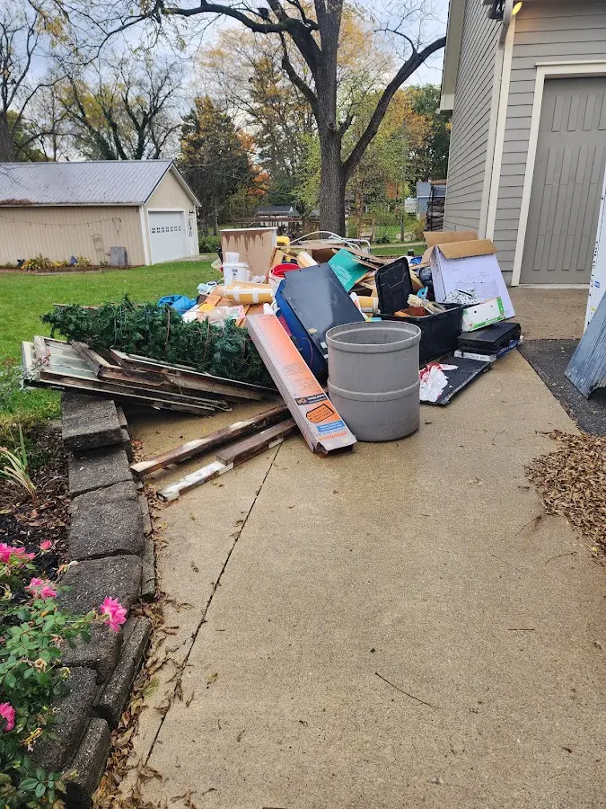 Dumpster being loaded with debris for Estate Cleanout Dumpster Rental in Lower Chichester